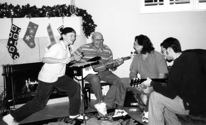 Grandaddy Elliott, David, Jeremy, and Jon rehearsing on Christmas Day 1999